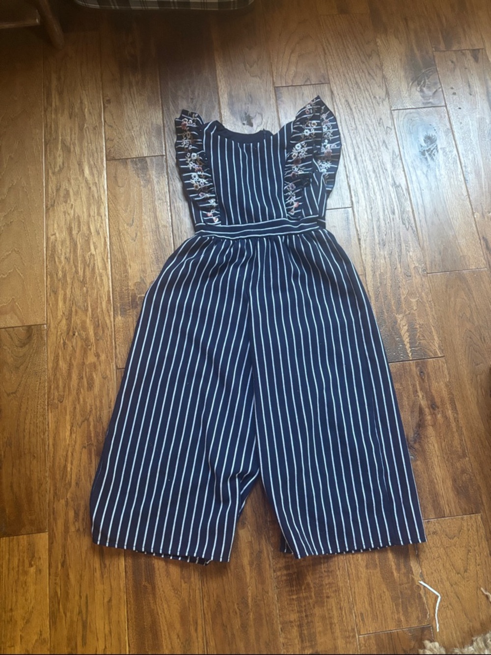 Navy & White Striped Jumpsuit with Floral Ruffle Shoulders